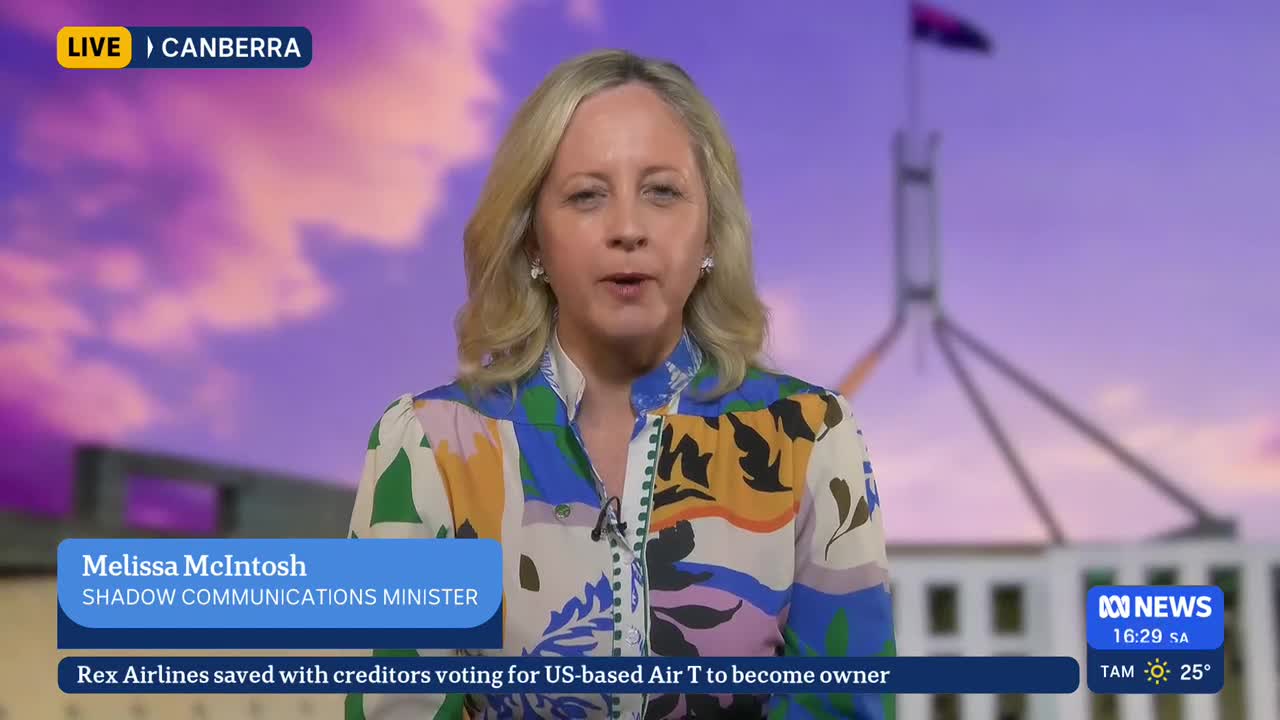 The ABC News presenter, Melissa McIntosh, is speaking directly to the camera from Canberra. Behind her, the Australian Parliament House is visible against a ...