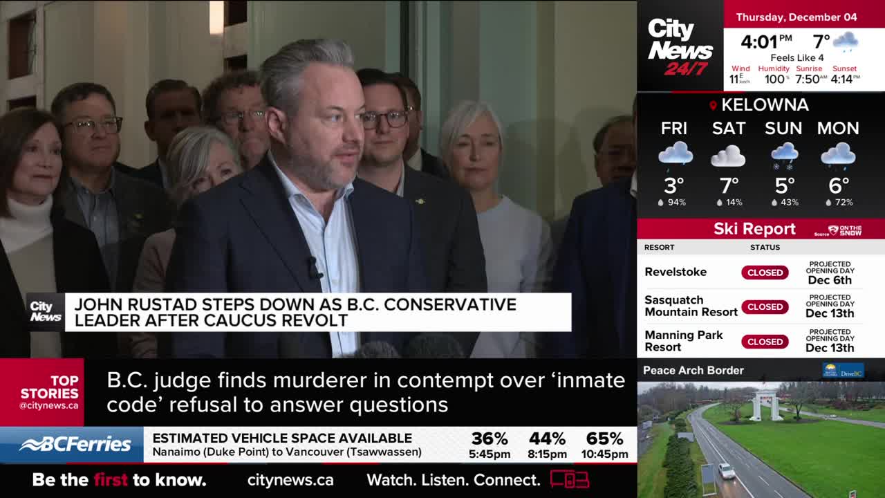 John Rustad, the B.C. Conservative leader, is speaking to a crowd, the CityNews Vancouver graphic says he's stepping down. Behind him, a group of people stan...