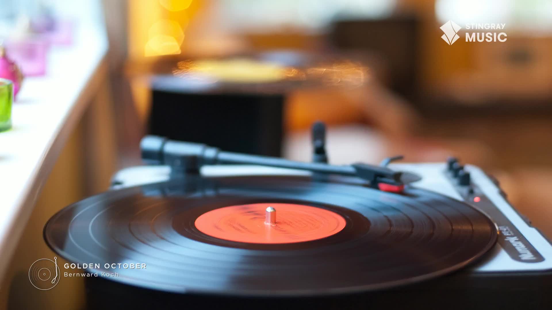 A black vinyl record spins on a turntable, its orange label visible. The needle rests gently on the grooves, promising the Stingray Easy Listening sounds of ...