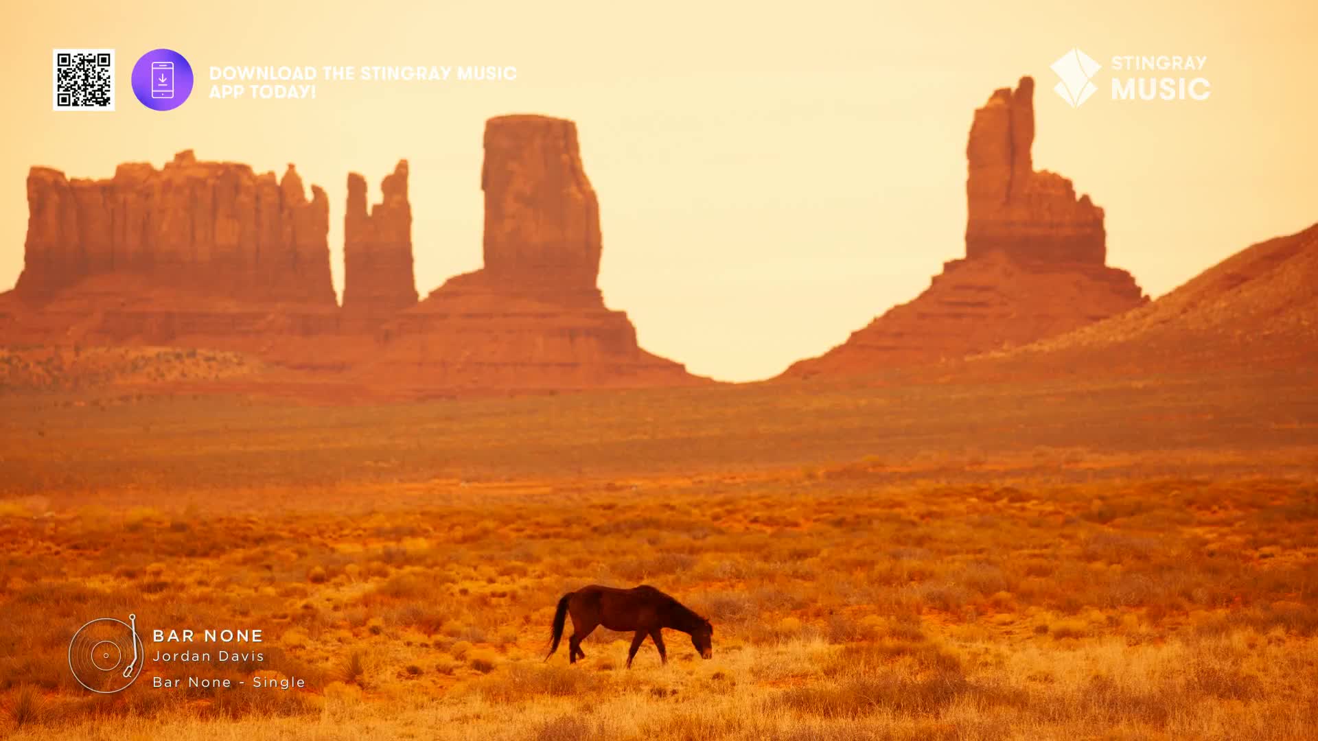 A lone horse grazes in a field, dwarfed by the towering rock formations in the distance. The Stingray Hot Country logo and a QR code sit in the top left corn...