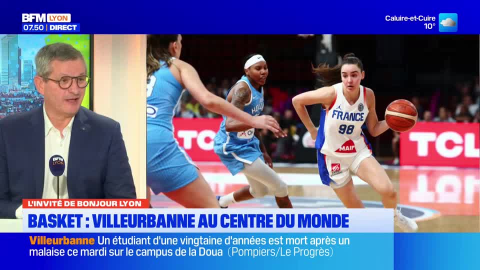 A French basketball player in a white jersey with "France 98" on it dribbles the ball. Another player in a light blue uniform moves past her, while a third p...