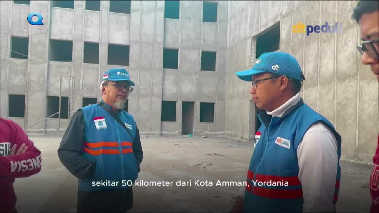Three men in blue vests and caps stand in front of a large, unfinished concrete building. The MQTV logo is visible in the corner, and the caption mentions a ...