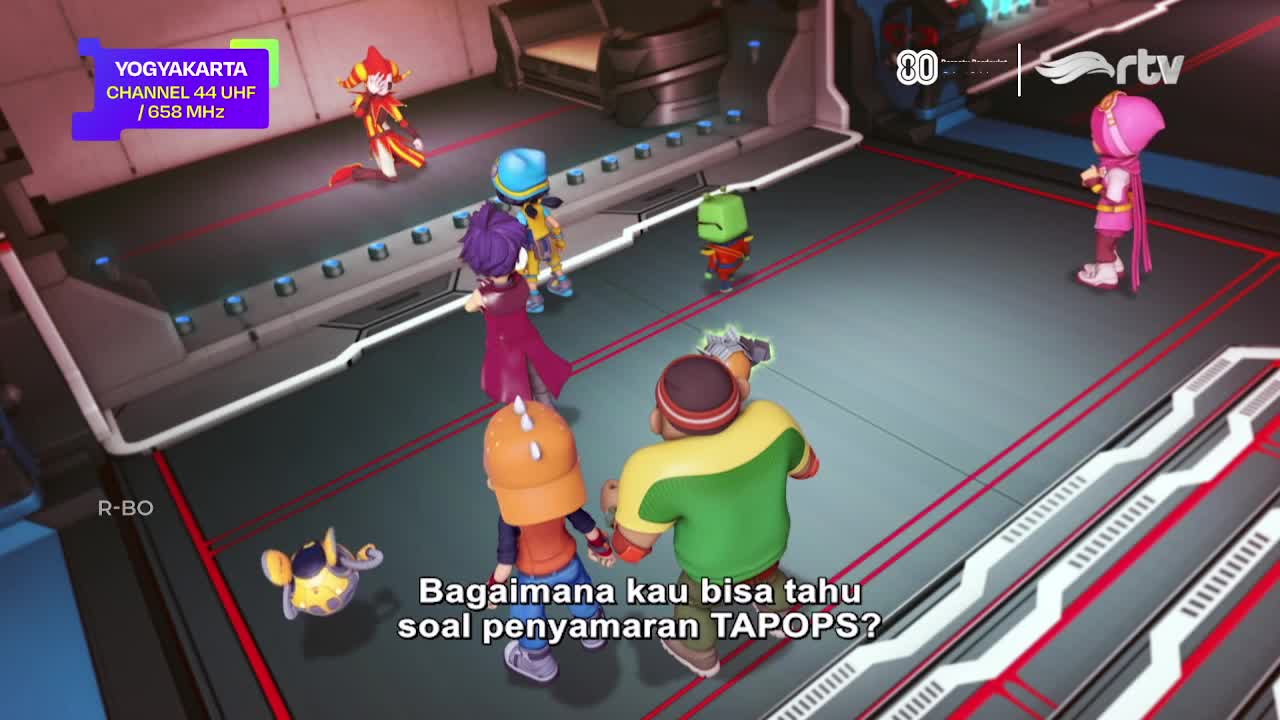 A group of animated characters are gathered on a metallic-looking floor, with one asking a question about TAPOPS, as seen on Rajawali TV. The scene is set in...