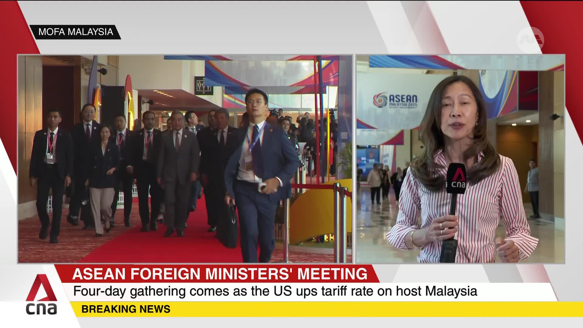 A group of suited officials strides down a red carpet, heading toward a large hall as reported by CNA International. A news anchor in a striped shirt speaks ...