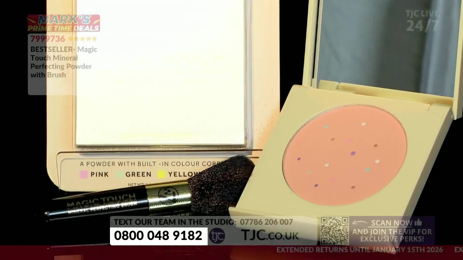 A compact of peach-colored powder with colorful dots sits open, next to a brush and a mirror. The TJC logo and a phone number are displayed on the screen.