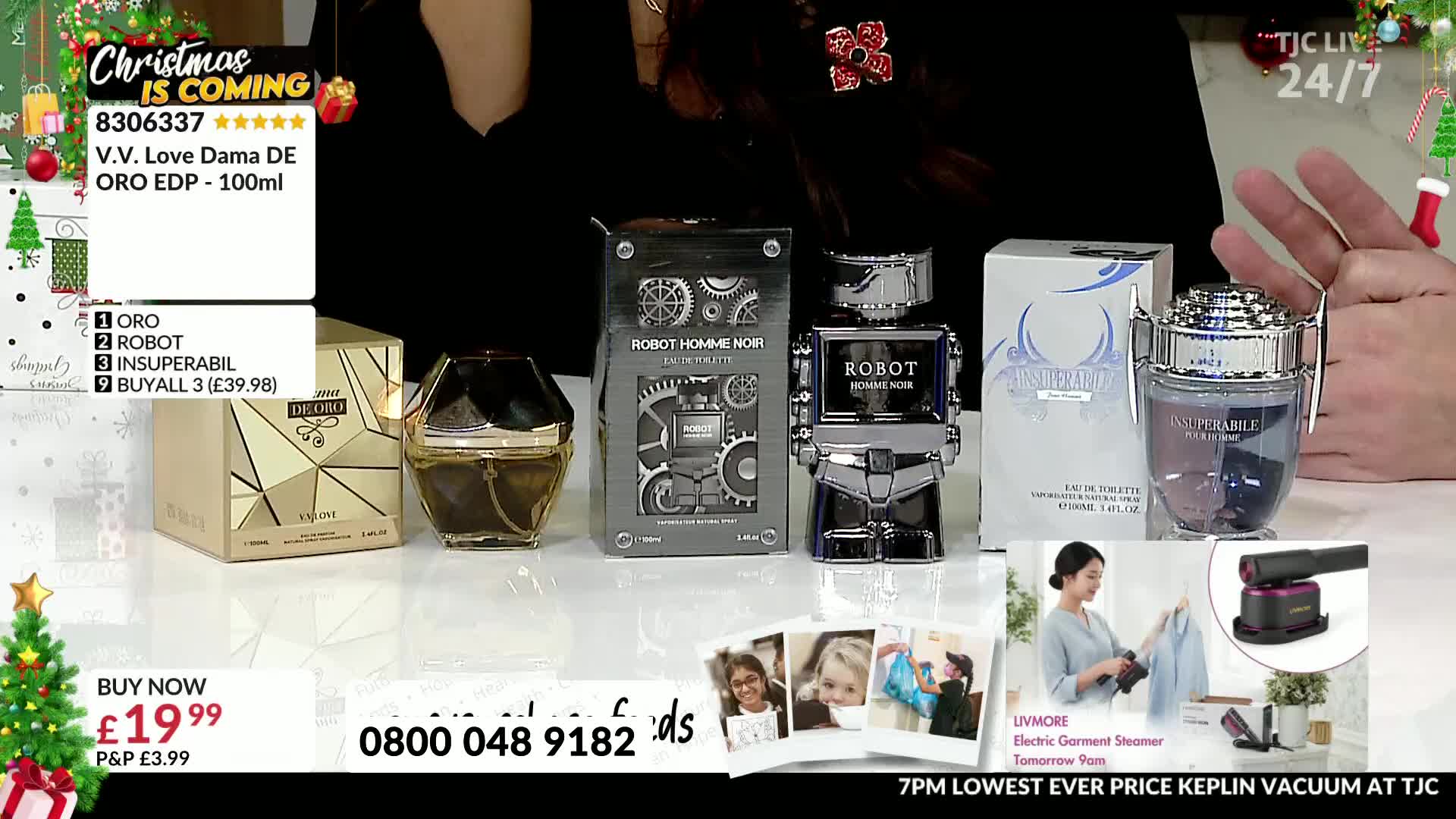 Several perfume bottles sit on a white surface, with a person's hands and a Christmas tree visible in the background. A "TJC" logo is in the top right corner...