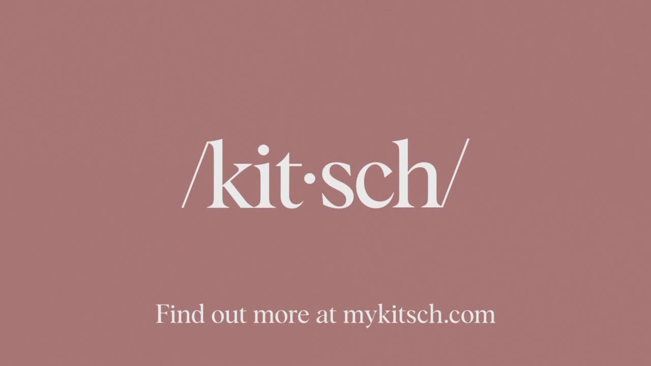 Against a muted rose background, the word "kitsch" is displayed in elegant white lettering. Below, a prompt encourages viewers to visit a website for more in...