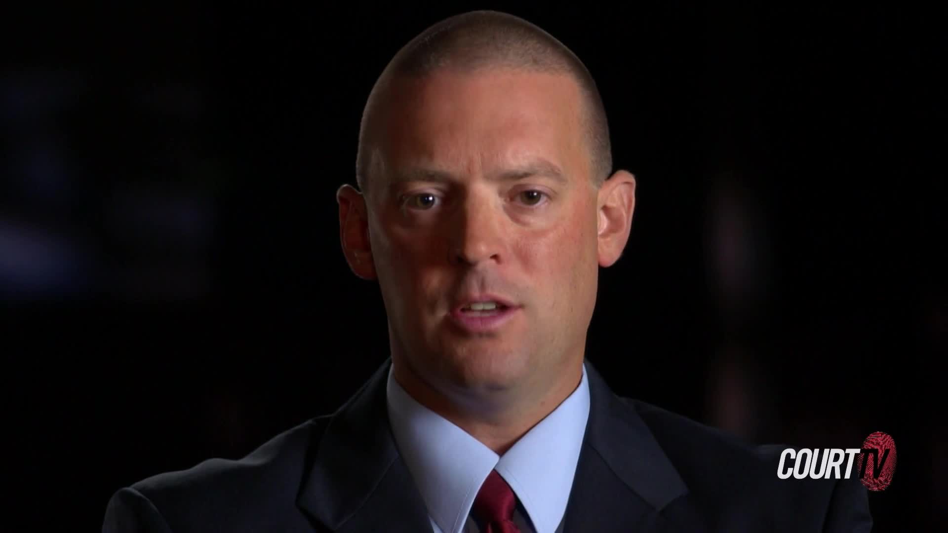 A man in a suit is speaking, his mouth moving as he addresses the camera. The Court TV logo is visible in the corner.