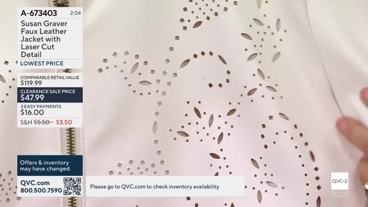 A hand gently touches a white jacket with small, cut-out shapes. The QVC2 screen displays the jacket's details, including the sale price.