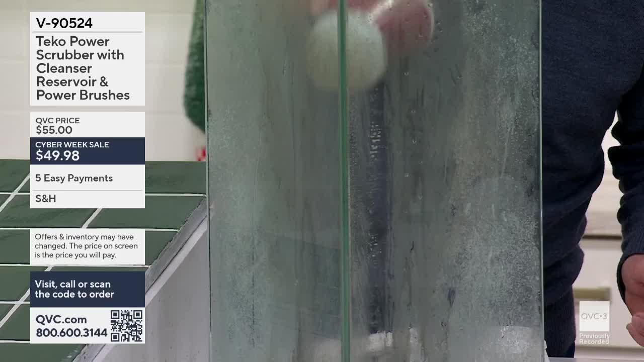 A power scrubber, advertised on QVC3, is being used on a glass panel, and the surface is visibly wet. The product demonstration is taking place in the United...