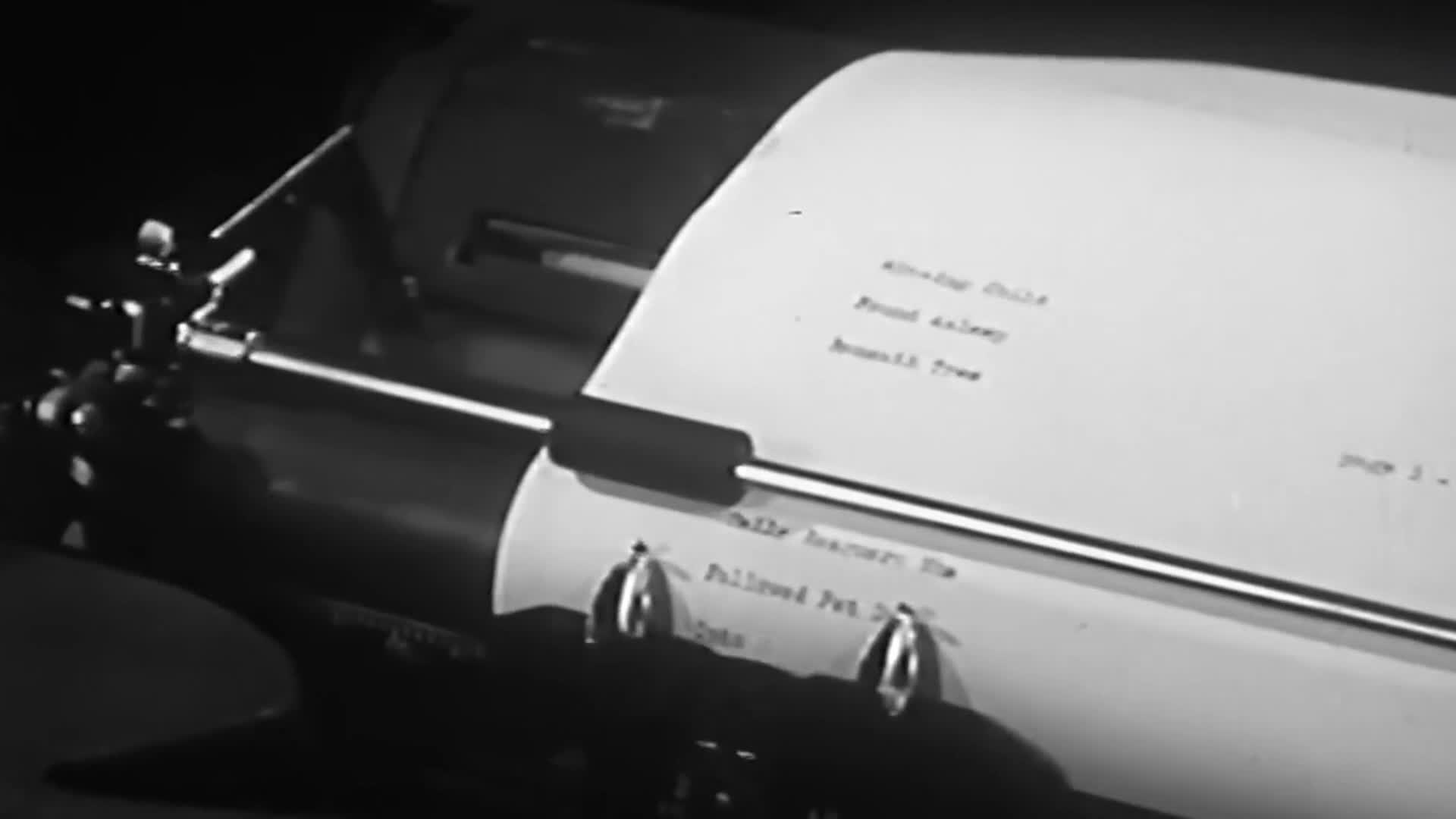 The typewriter's carriage is moving, and the paper is slowly filling with typed words. The scene feels old, like something from a United States VICE TV docum...